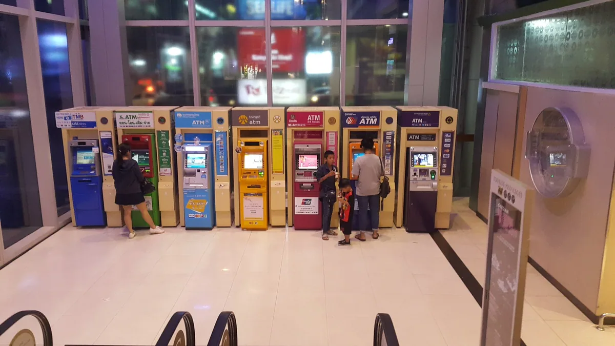 A row of ATMs from different Thai banks inside the Siam Paragon shopping centre in Bangkok