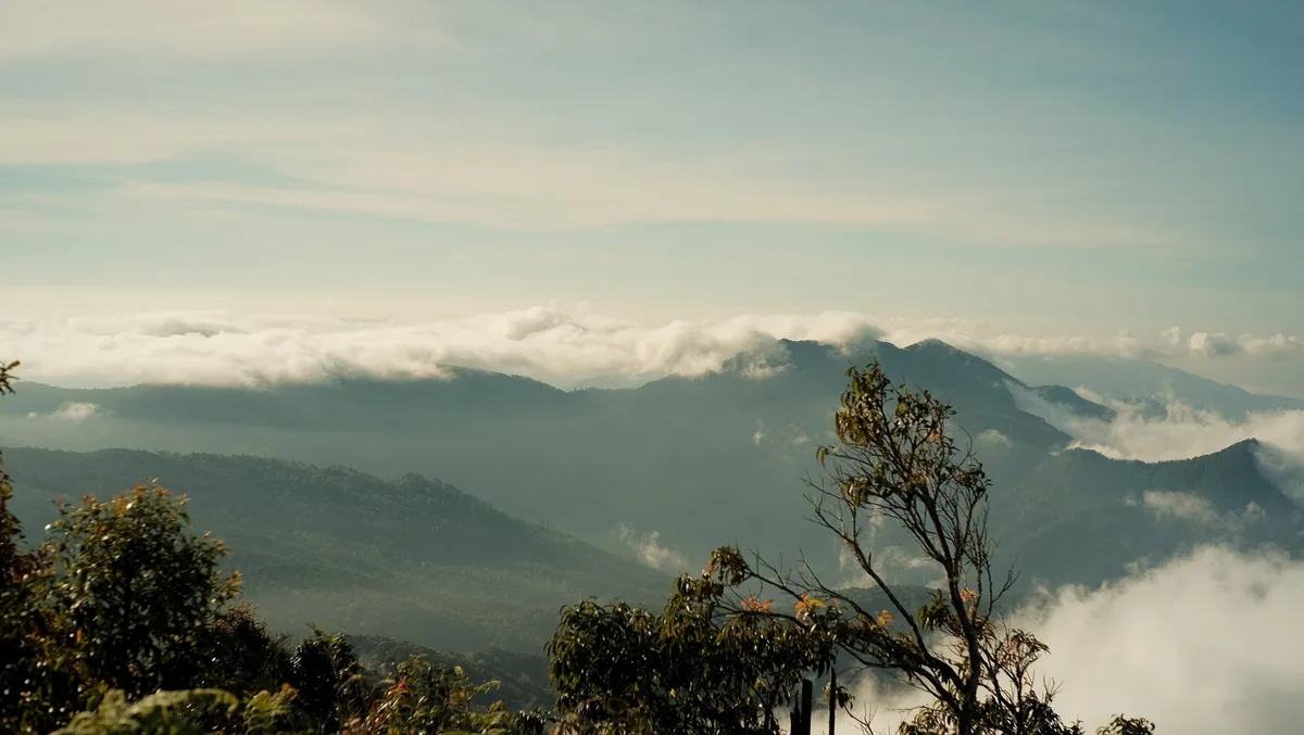 Sea of clouds below forested ridges seen from Doi Inthanon National Park