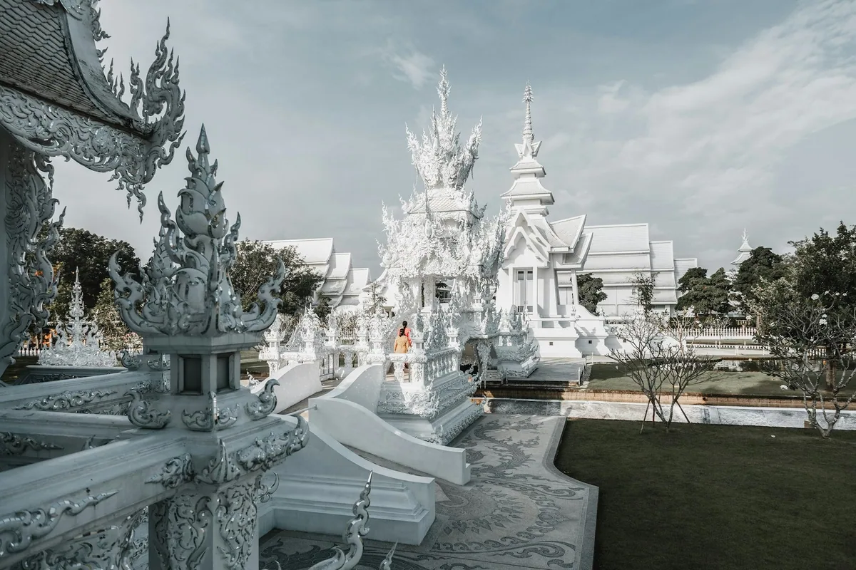 Ornate white sculptures and spires of Wat Rong Khun, the White Temple near Chiang Rai