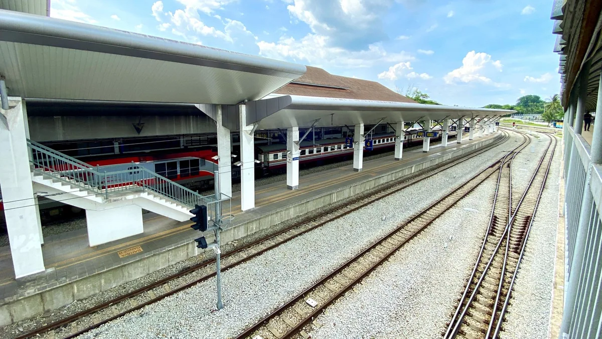 Thai ordinary express train waiting at a platform of Padang Besar station on the Malaysia–Thailand border