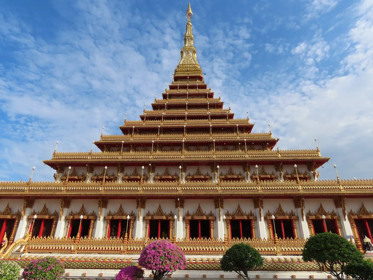 The nine-tiered white-and-gold Phra Mahathat Kaen Nakhon stupa at Wat Nong Waeng in Khon Kaen