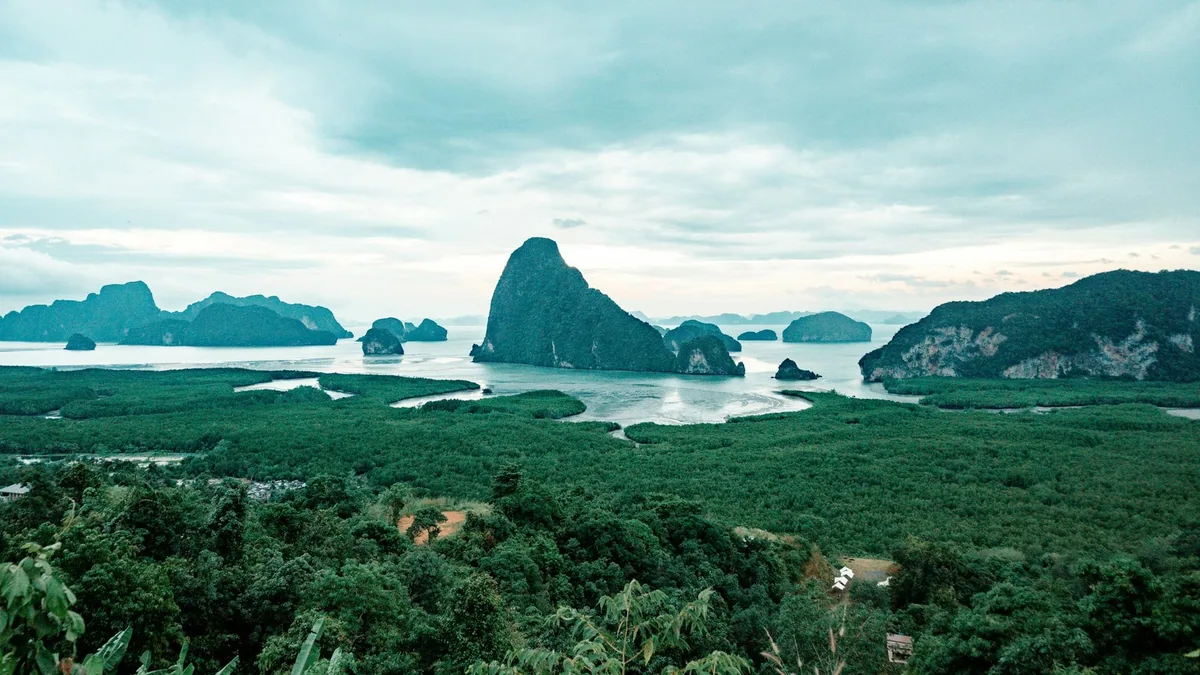 Limestone islands rising from Phang Nga Bay beyond the mangrove forest, seen from the Samet Nangshe viewpoint