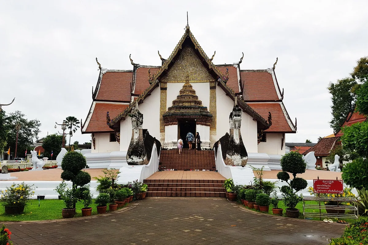 Wat Phumin in Nan, its cruciform white hall with tiered roofs and naga serpents flanking the entrance stairs