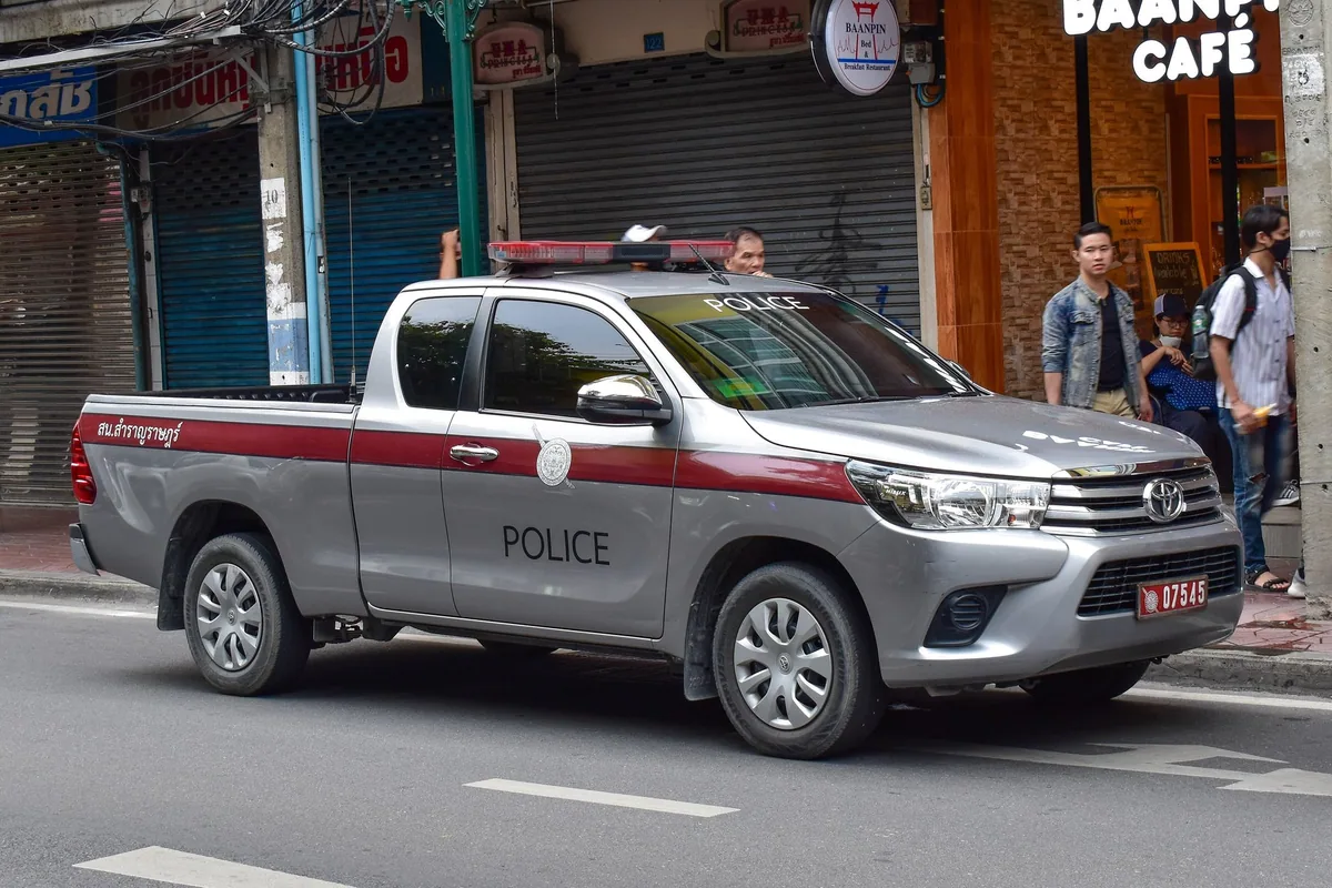 A Royal Thai Police pickup truck of the Metropolitan Police Bureau parked on a Bangkok street