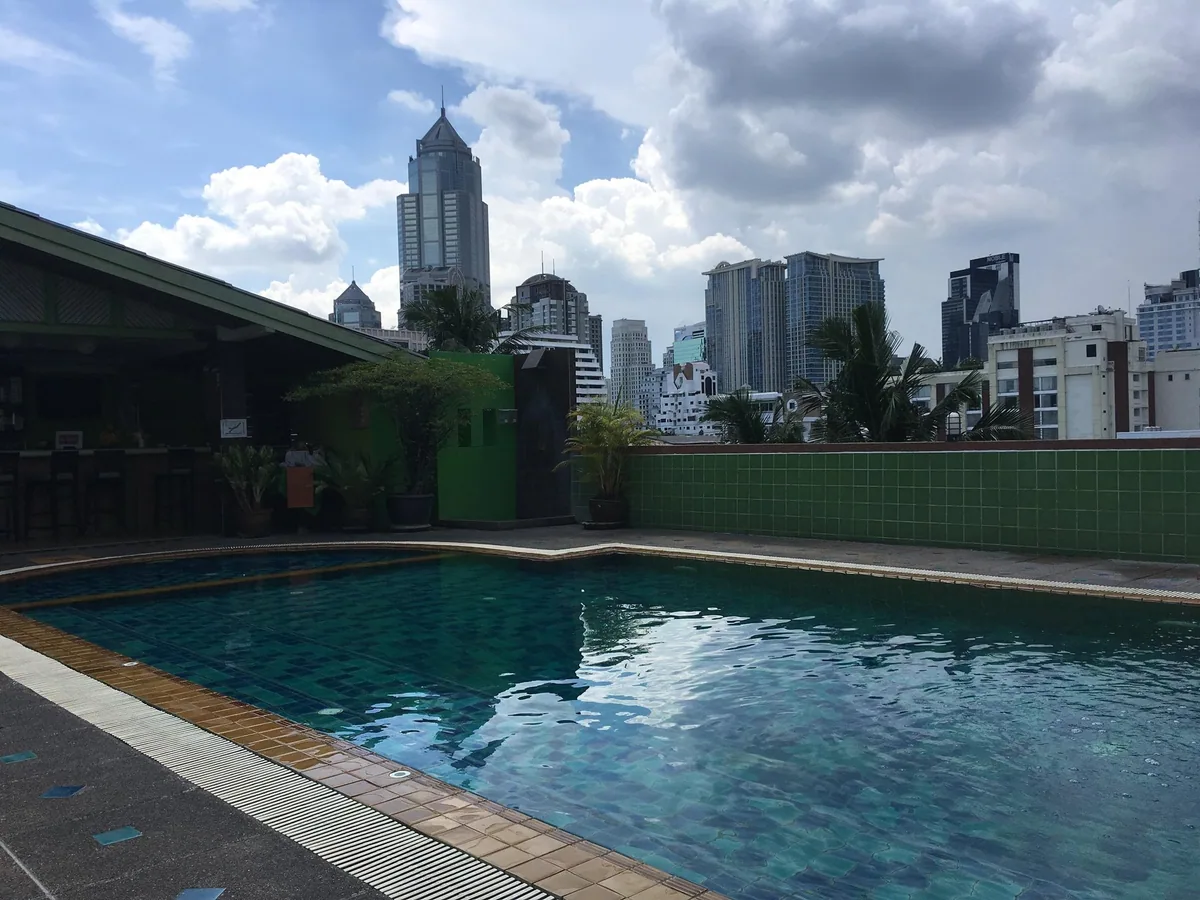 A hotel swimming pool among the high-rises of Sukhumvit in Bangkok