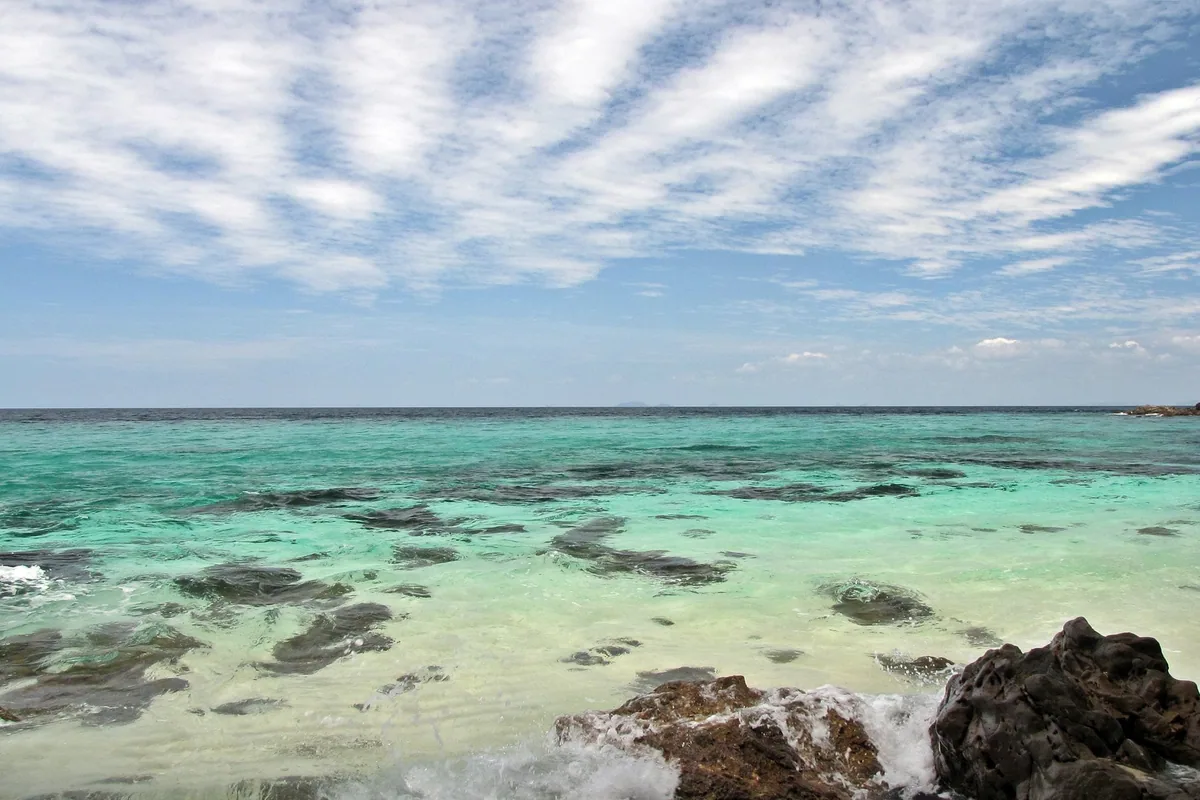 Clear turquoise water over coral and rocks at Ko Khai in Tarutao National Marine Park