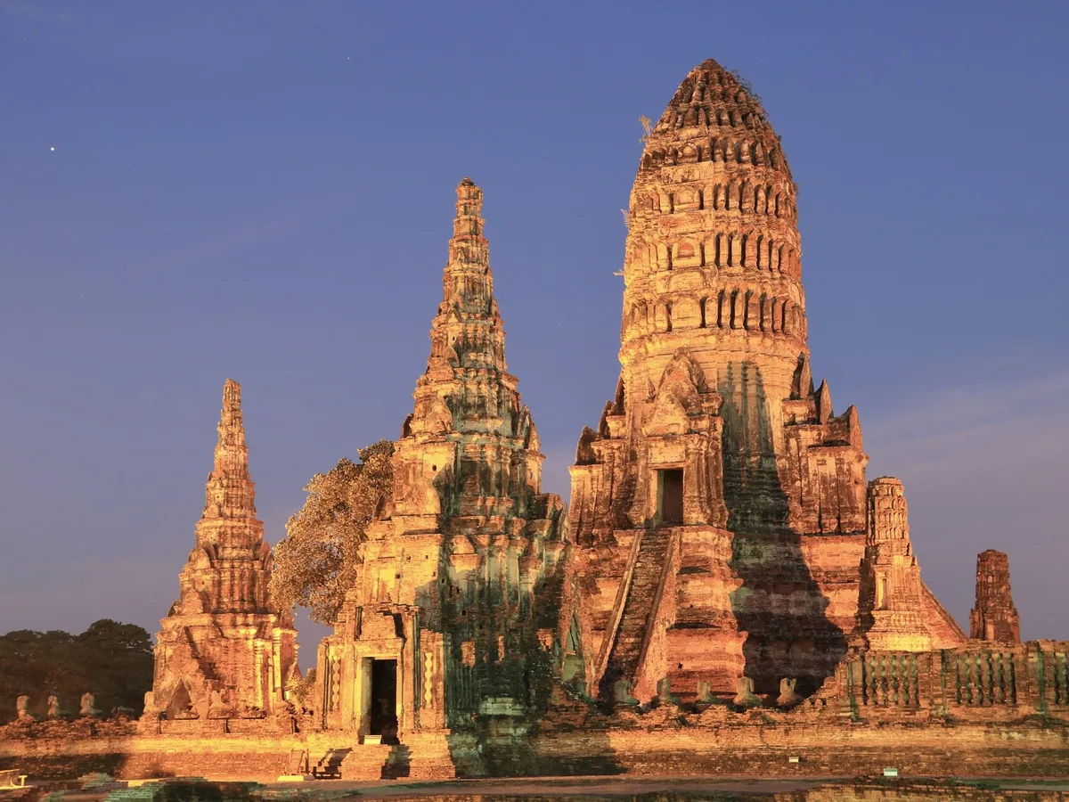 The prangs of Wat Chaiwatthanaram in Ayutthaya glowing in late afternoon light