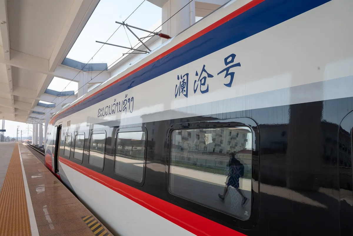 A Laos-China Railway train waiting at the platform of Vientiane railway station