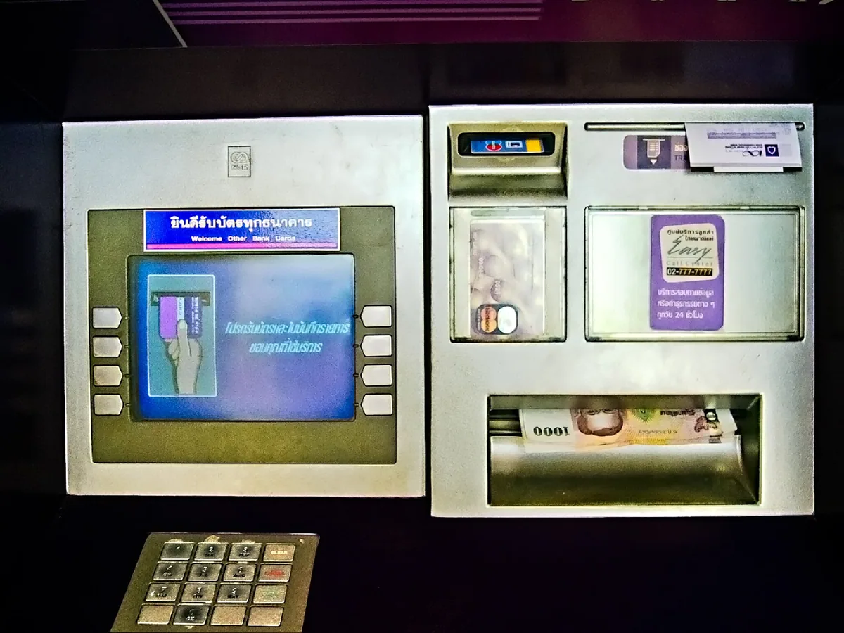 Siam Commercial Bank cash machine with card slot, keypad and Thai-language screen
